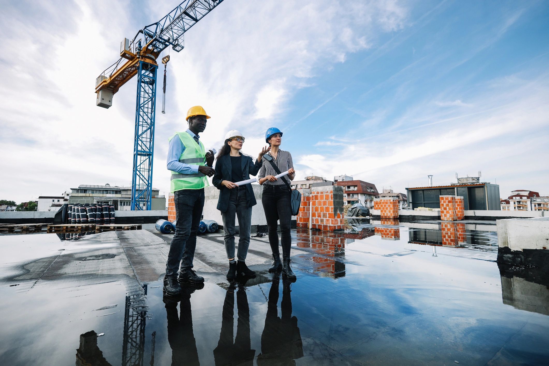 Project stakeholders reviewing plans at a commercial construction site