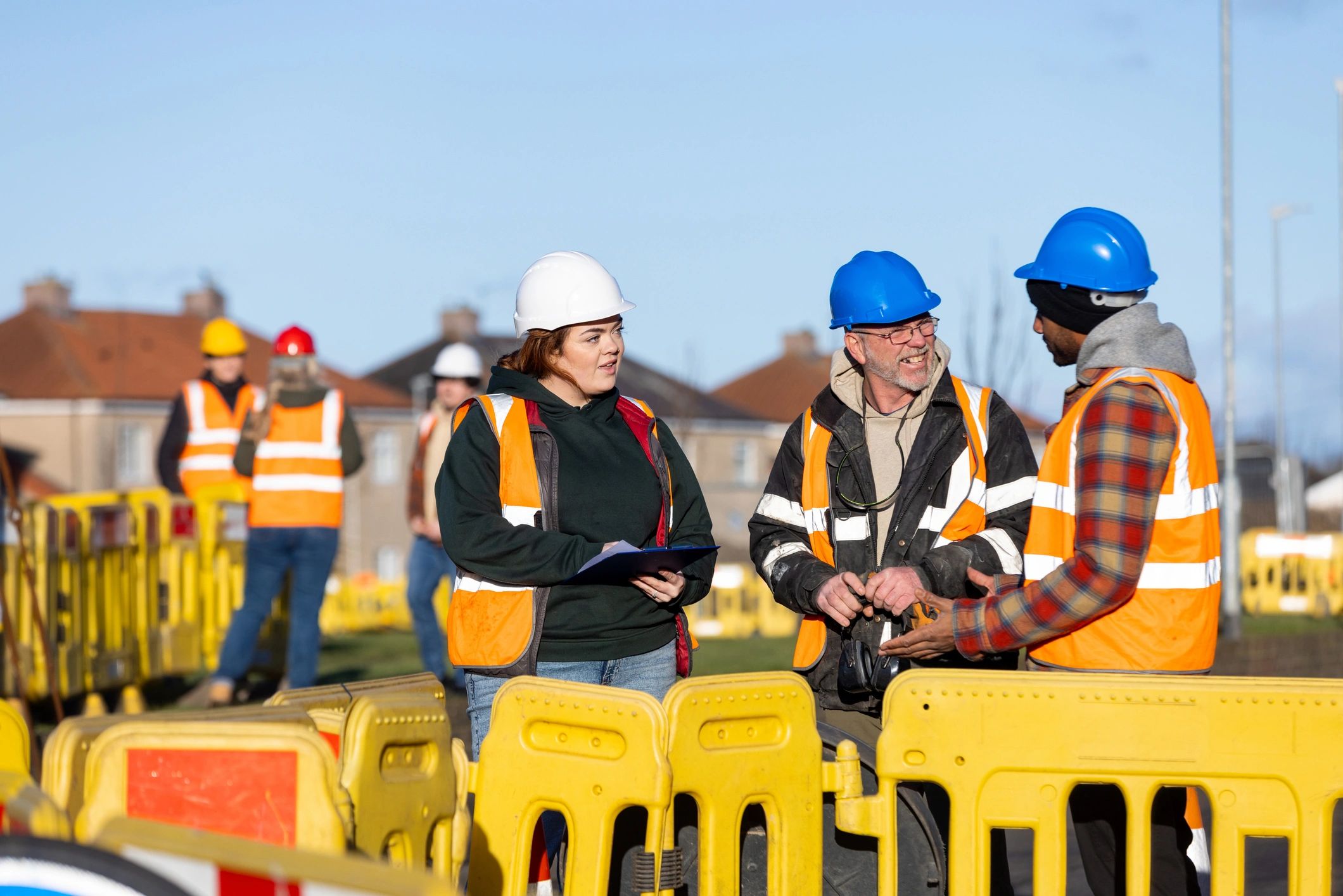 Office build-out progress: engineers reviewing work plans
