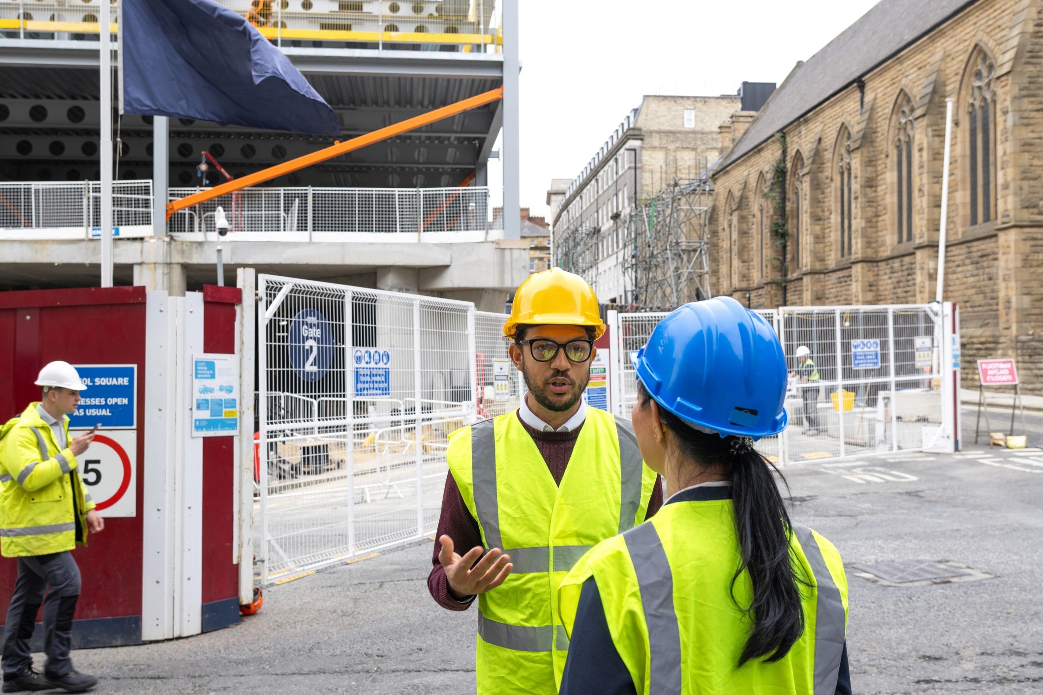 Project stakeholders in safety gear on a construction site